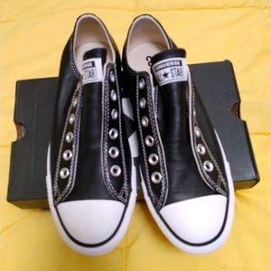Converse Black Leather Low Top tennis shoes.